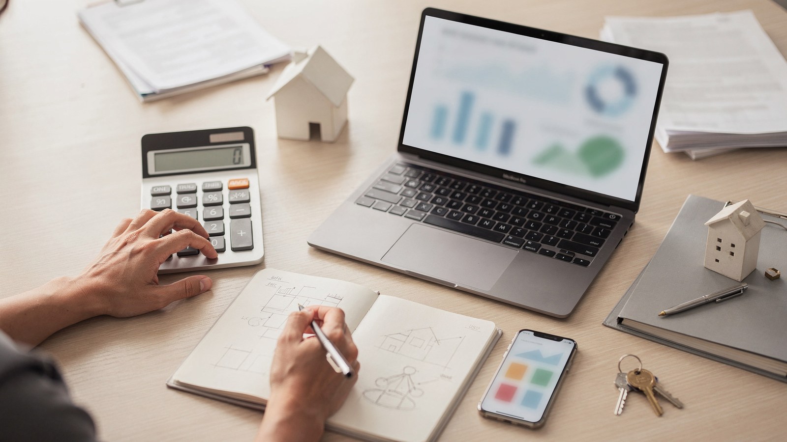 A buyer or investor using practical real estate calculators and tools with calm advisor guidance.