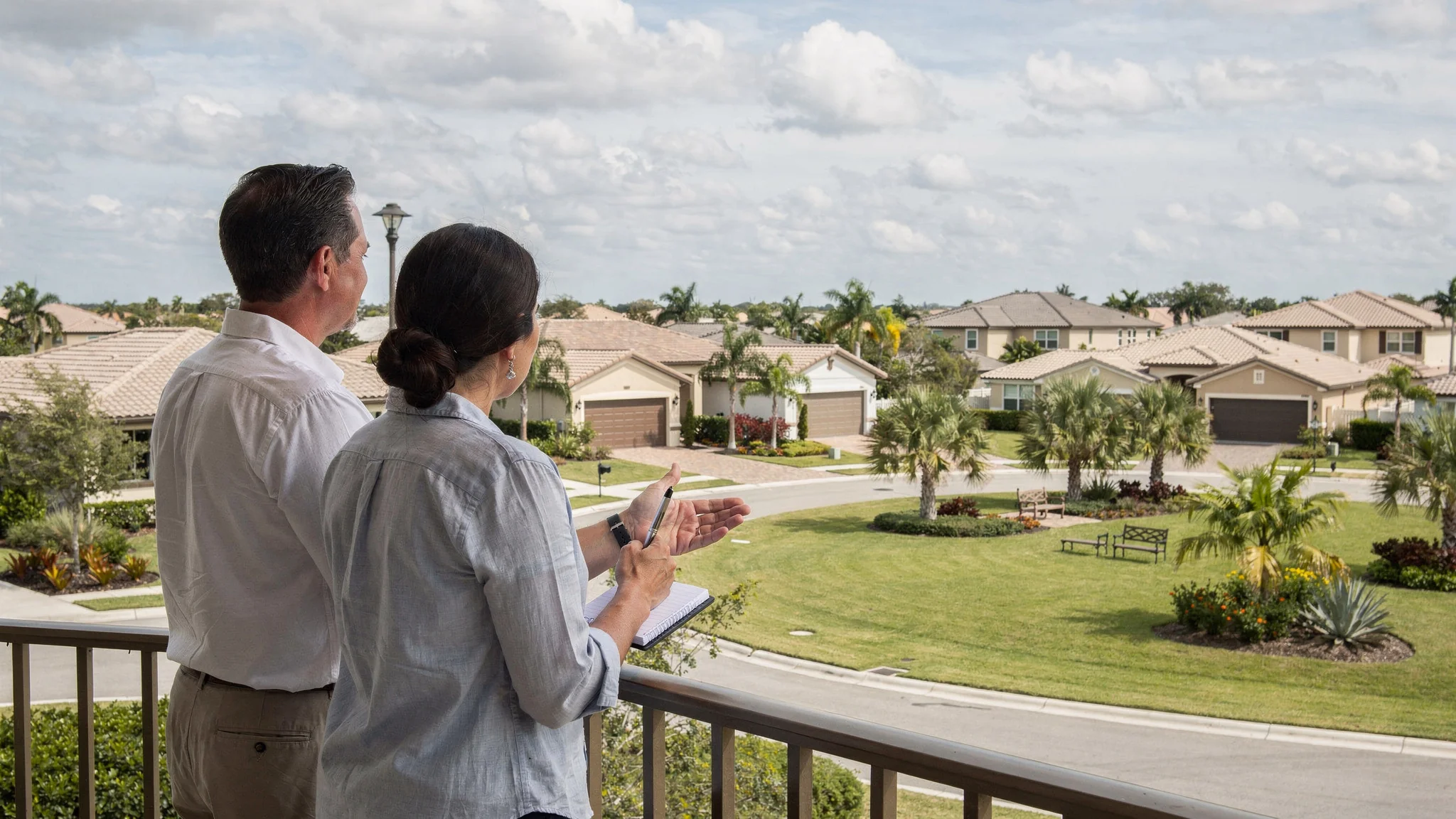 Buyer and advisor calmly comparing two South Florida residential communities before reviewing the exact documents, costs, rules, and responsibilities.