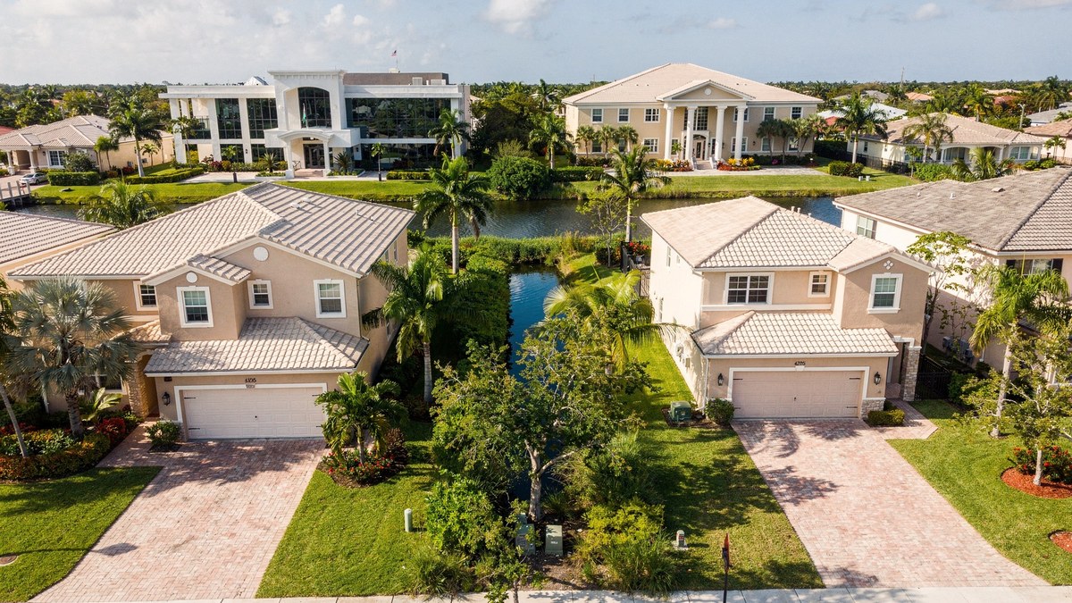 Two similar Miami-Dade homes sit in different local service areas