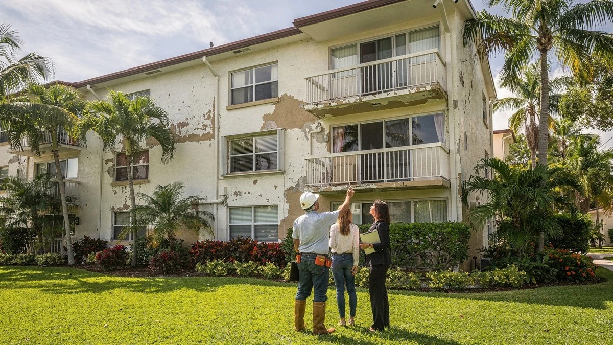 Buyer and professionals reviewing condition at a Miami residential building