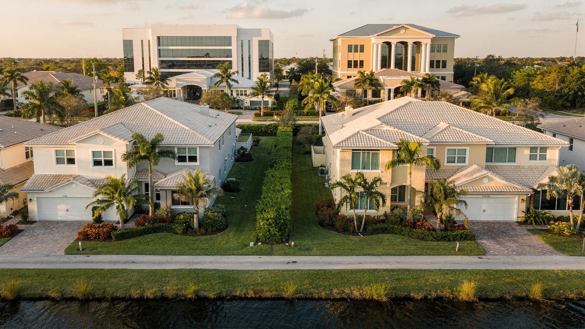 Two similar South Florida homes following different city and county service paths because their legal jurisdictions are different.
